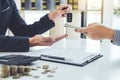 Salesman send key to customer after good deal agreement and receive money, successful car loan contract buying or selling new Royalty Free Stock Photo