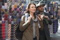 Salesman of ties on the design market Spitalfield shows how to t