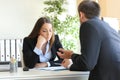 Salesman trying to convince to a bored client Royalty Free Stock Photo