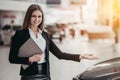 Salesperson at car dealership Royalty Free Stock Photo