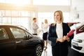 Salesperson working at car dealership