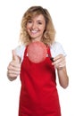 Saleswoman with blond hair recommending italian salami