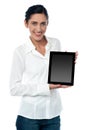 Saleswoman displaying new touch pad device