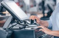 Saleswoman giving a discount to customer in the shopping center, finance concept Royalty Free Stock Photo