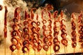 Saleswoman selling squid skewers