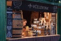 Saleswoman in stall with bee products at Christmas market