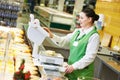 Saleswoman in supermarket shop Royalty Free Stock Photo