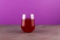 Salgam or fermented beet juice in clear glass. Popular Turkish drink. Traditional beverage made with water, purple carrot or