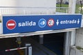 Salida, entrada sign at underground parking entrance. Exit, entry in spanish