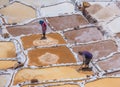 SALINAS DE MARAS, PERU: Workers extracting salt at Salinas de Maras, man-made salt mines near Cusco, Peru.