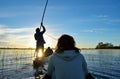 Saling in the Okavango delta at sunset, Botswana