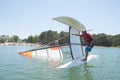 Salior trying to right catamaran after capsize