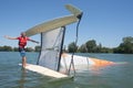 Salior trying to right catamaran after capsize Royalty Free Stock Photo