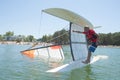 Salior trying to right catamaran after capsize