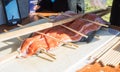 Salmon baking at open wood fire pit