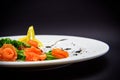 Salted salmon with garnish on black background