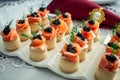 Salmon and black caviar canapÃÂ©s on plate Royalty Free Stock Photo