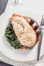 Salmon with breadcrumbs, olives and spinach