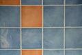 Salmon brown and grey tiles brick wall gray square background Royalty Free Stock Photo