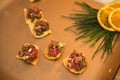 Salmon bruschetta with herbs and onion on lemon plate. Royalty Free Stock Photo