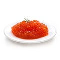 Salmon caviar on a ceramic plate