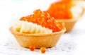 Salmon caviar. Tartlets with red caviar. Gourmet food. Seafood. Trout caviar