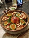 Salmon Chirashi Don, A traditional Japanese cuisine consists of a rice bowl with raw salmon, salmon roe, egg yolk, and cucumber Royalty Free Stock Photo