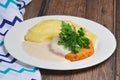 Salmon cutlet and mashed potato with creamy sauce Royalty Free Stock Photo