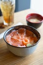 Salmon Donburi serve with miso soup on wooden table Royalty Free Stock Photo