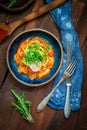 Salmon fillet ceviche with marinated, green, parsley, onion on blue plate Royalty Free Stock Photo