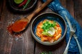 Salmon fillet ceviche with marinated, green, parsley, onion on blue plate Royalty Free Stock Photo