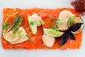 Salmon fillet, creative serving salmon sashimi with lime and Basil. Healthy concept, gluten free, lectine free