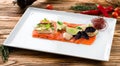 Salmon fillet, creative serving salmon sashimi with lime and Basil. Healthy concept, gluten free, lectine free