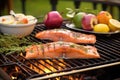 salmon fillet grilling, fresh apple cider sauce in foreground