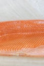 Salmon Fillet in Ice on the supermarket counter. Fillet of red fish in the ice in the supermarket. Marine healthy food. vertical p Royalty Free Stock Photo