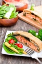 Salmon fillet on leek and spinach baked in puff pastry Royalty Free Stock Photo