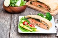 Salmon fillet on leek and spinach baked in puff pastry Royalty Free Stock Photo