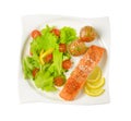 Salmon fillet with roasted potatoes and fresh vegetables Royalty Free Stock Photo