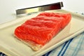 Salmon fillet and a tongs Royalty Free Stock Photo