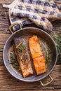 Salmon fillets. Grilled salmon, sesame seeds herb decorationon on vintage pan or black slate board. Royalty Free Stock Photo