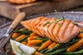Salmon fillets. Grilled salmon, sesame seeds herb decorationon on vintage pan or black slate board. Royalty Free Stock Photo