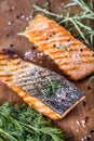 Salmon fillets. Grilled salmon, sesame seeds herb decorationon on vintage pan or black slate board. Royalty Free Stock Photo