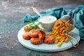 Salmon fish cutlets with fried kohlrabi and sauce of coconut yoghurt or mayonnaise