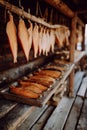 Salmon Fish Drying on Rustic Wooden Rack Outdoors Royalty Free Stock Photo
