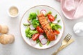 Salmon fish fillet grilled and vegetable salad with radish, tomato, green pepper, broccoli and asparagus Royalty Free Stock Photo