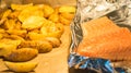 Salmon Fish with rosemary potatoes, baked in the oven. Royalty Free Stock Photo