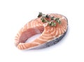 Salmon fish on white background with fresh oregano. Steak with spice isolated