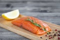 Salmon fresh raw fish fillet on wooden cutting board Royalty Free Stock Photo