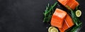 Salmon. Fresh raw salmon fish fillet with cooking ingredients, herbs and lemon on black background, top view, banner Royalty Free Stock Photo