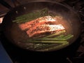 Salmon in frying pan Royalty Free Stock Photo